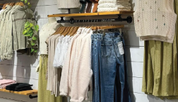 Image of clothes hanging up in store